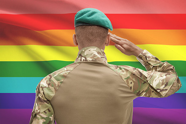 Soldier Saluting a Rainbow Flag